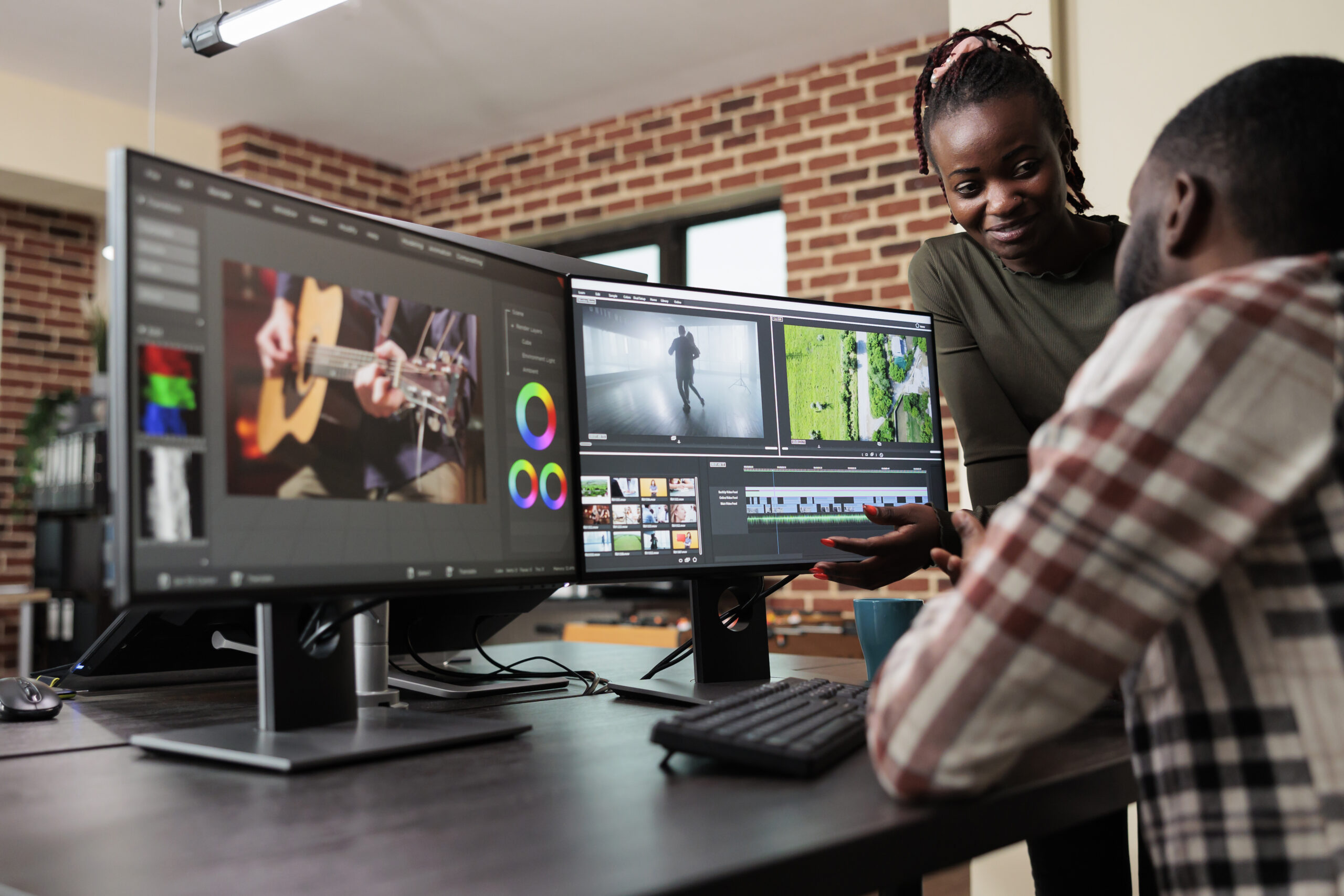 Post production department leader advising colleague to improve colors